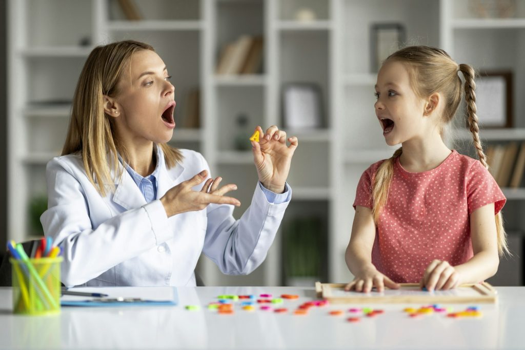 Effective Speech Therapy. Therapist Lady Having Lesson With Cute Little Girl